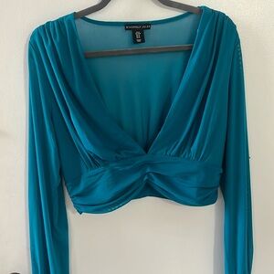 Woman’s turquoise v neck blouse, M